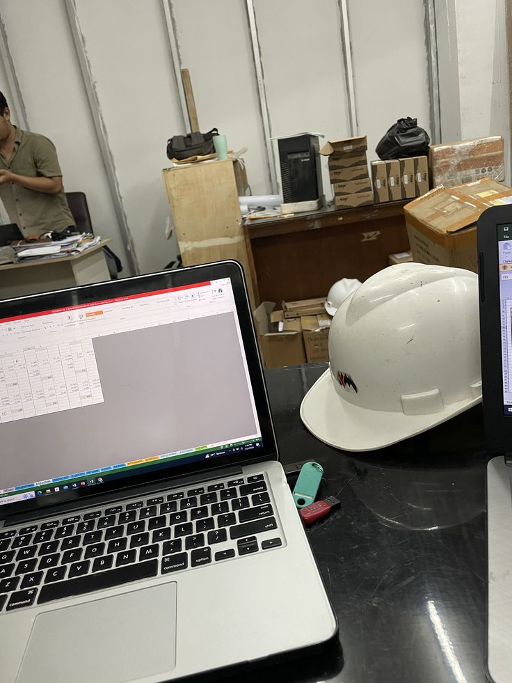 Engineering blueprints on desk